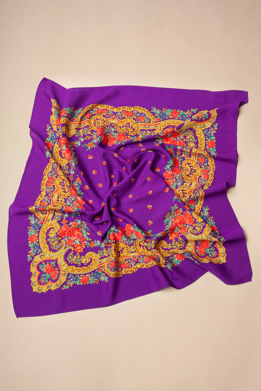 Purple square scarf with intricate yellow gold chain patterns and vibrant red floral borders.
