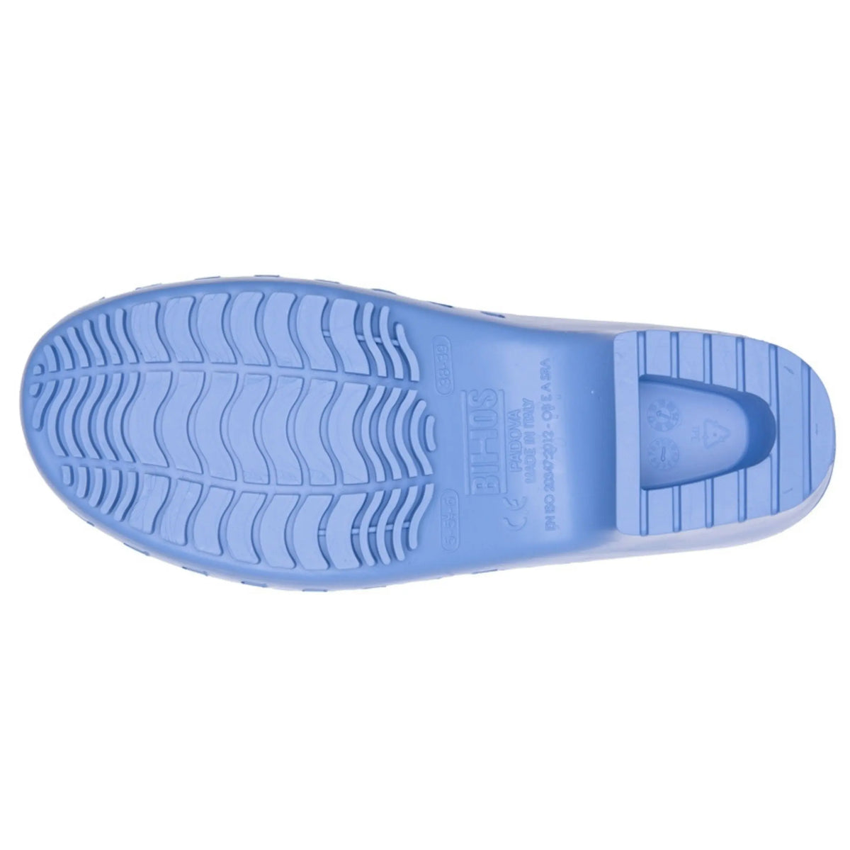 Bottom view of a light blue molded rubber clog with a textured, wavy anti-slip tread pattern and molded markings.