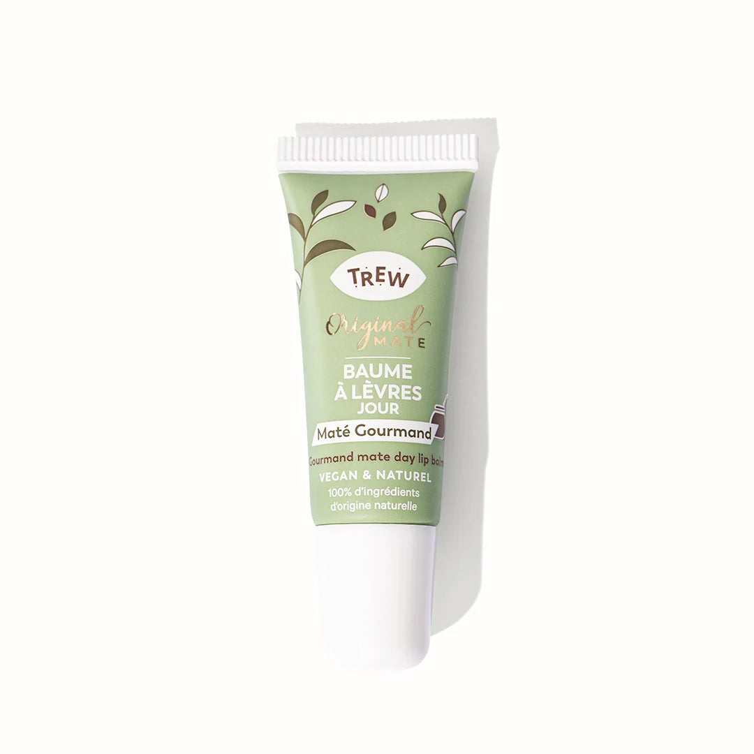 Sage green squeeze tube of lip balm with white cap, featuring brown text and leaf illustrations on a white background.