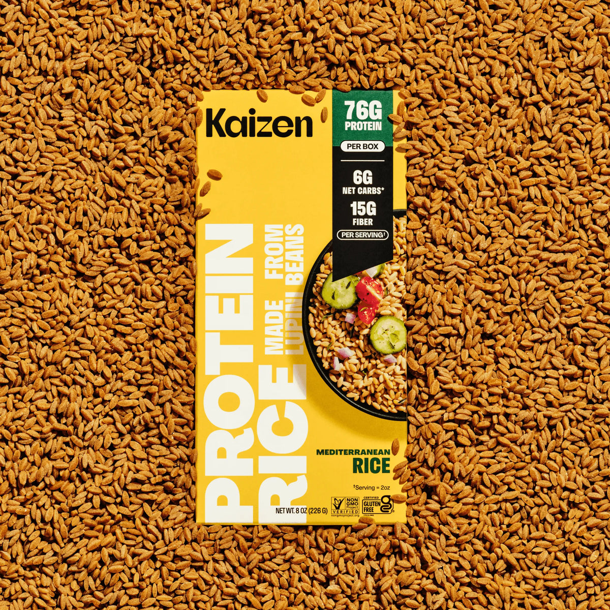 Kaizen Mediterranean Protein Rice box on a bed of raw grains, highlighting nutritional facts and a prepared rice bowl.