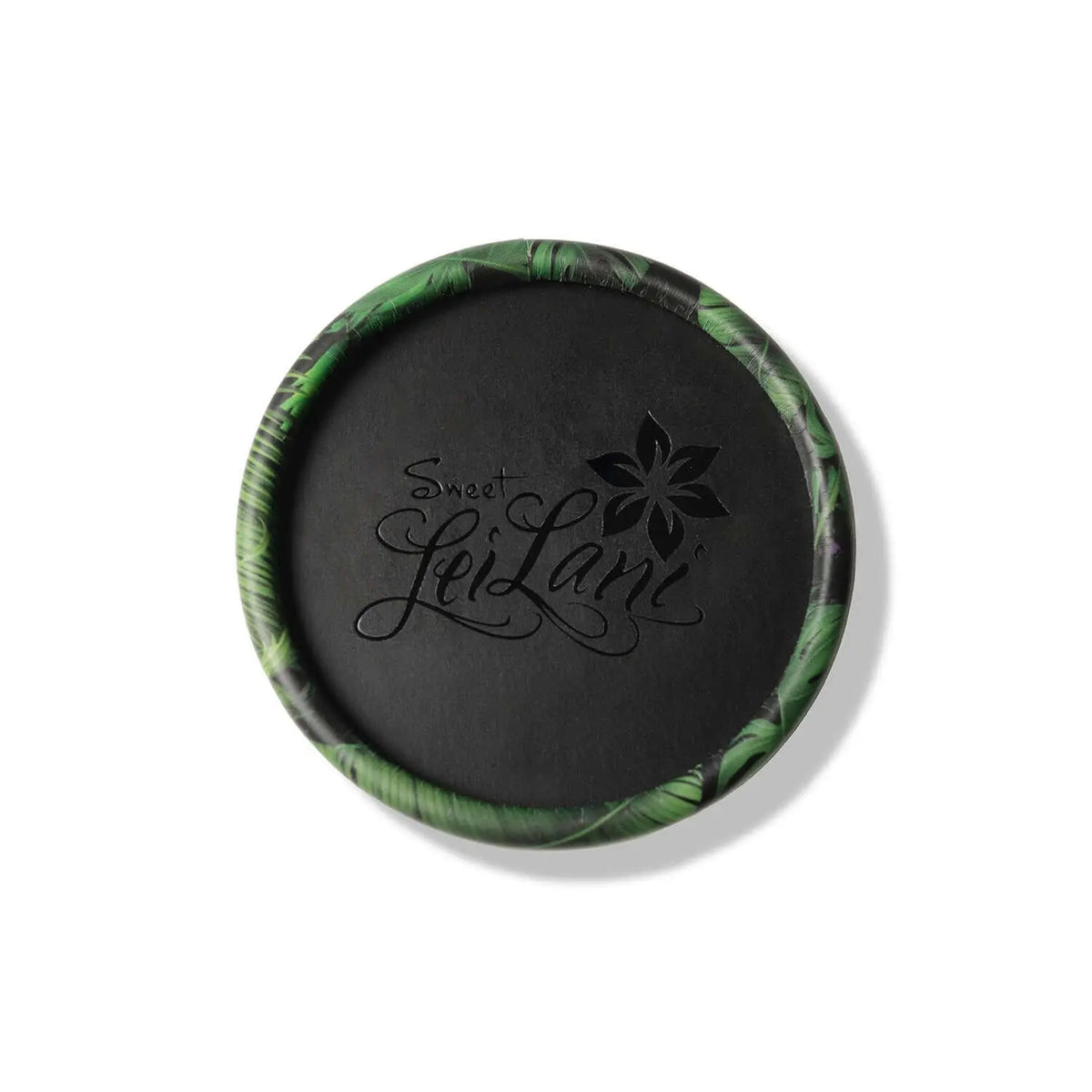 Round black container with a tropical green leaf pattern border and Sweet LeiLani logo debossed on the lid.