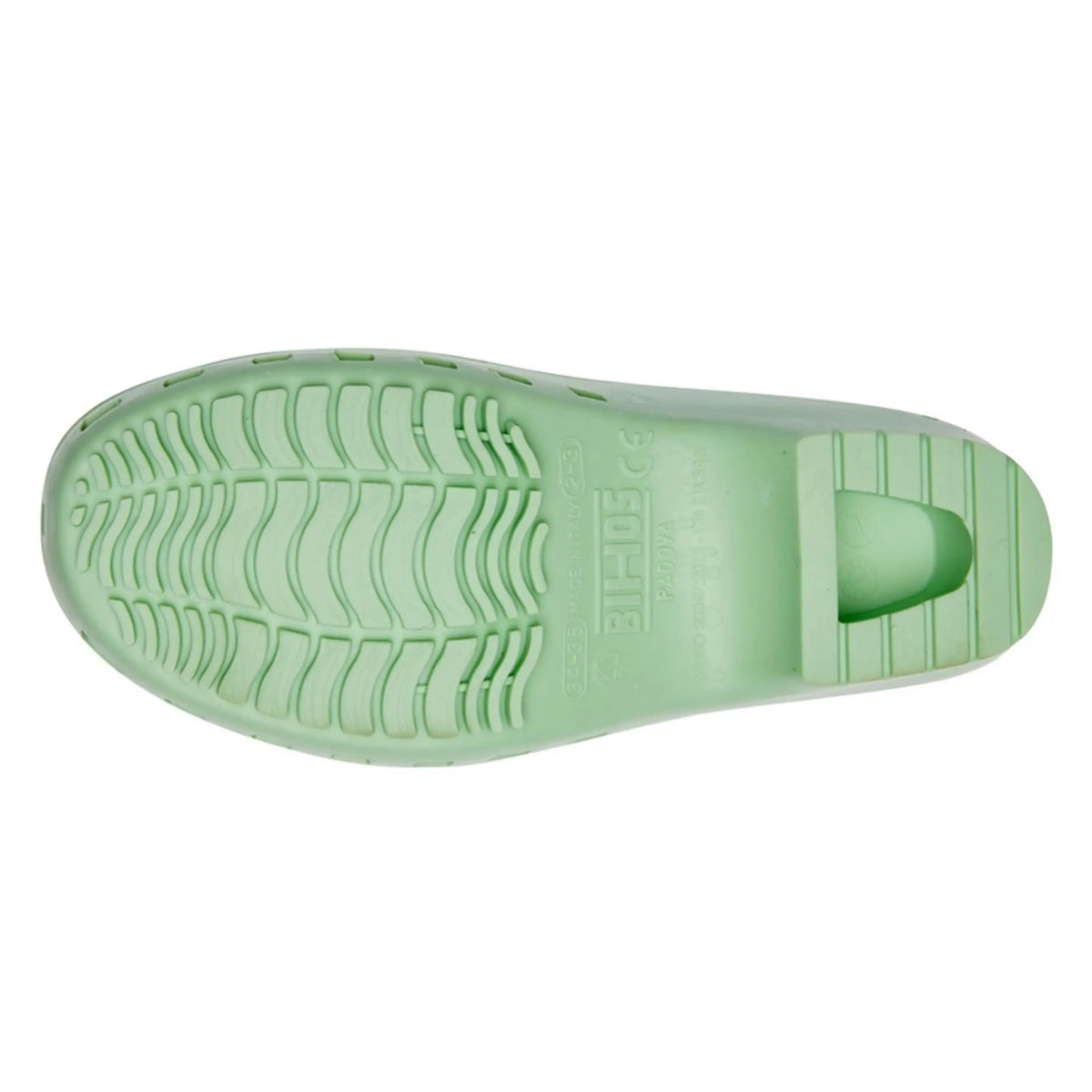 Pistachio green rubber clog shown from the sole, featuring a non-slip wave pattern and an integrated heel.