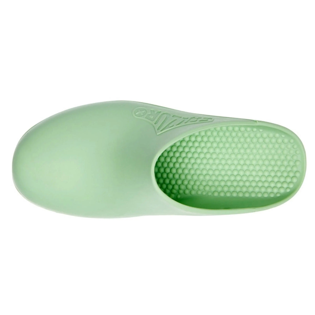 Top view of a smooth, pistachio-green rubber clog with a textured, studded interior sole and no ventilation holes.