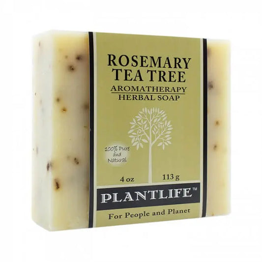 Rectangular bar of light-colored, speckled herbal soap wrapped in a green paper label featuring tree iconography.
