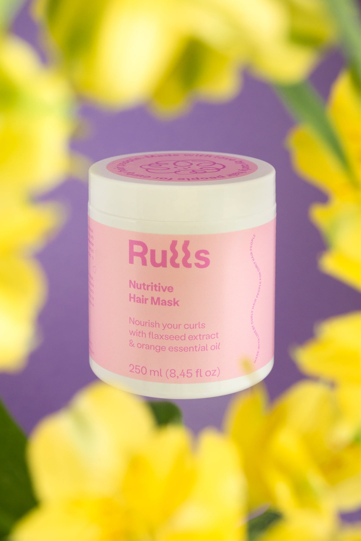 Mascarilla capilar nutritiva RuLls, 250 ml, en frasco rosa con extracto de linaza y aceite esencial de naranja.