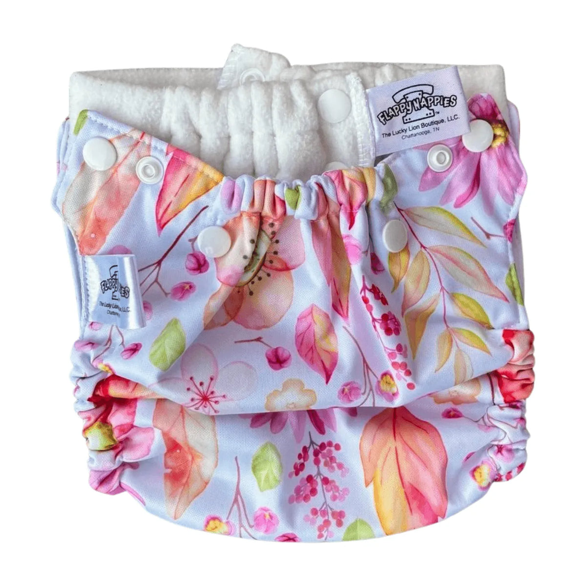 All-in-two diaper cover with floral leaf print, snap closures, and elastic leg gussets on a white background.