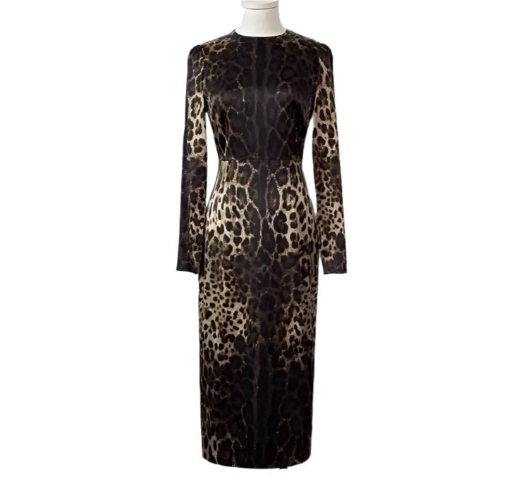 Leopard print long-sleeve dress in shades of brown and black, elegant fitted style, perfect for evening events.