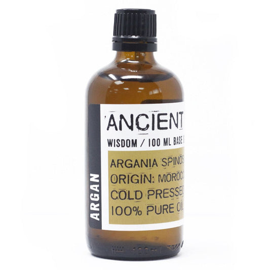 Botella de vidrio ámbar de 100ml con aceite de argán Ancient Wisdom, tapón negro y etiqueta con texto informativo.