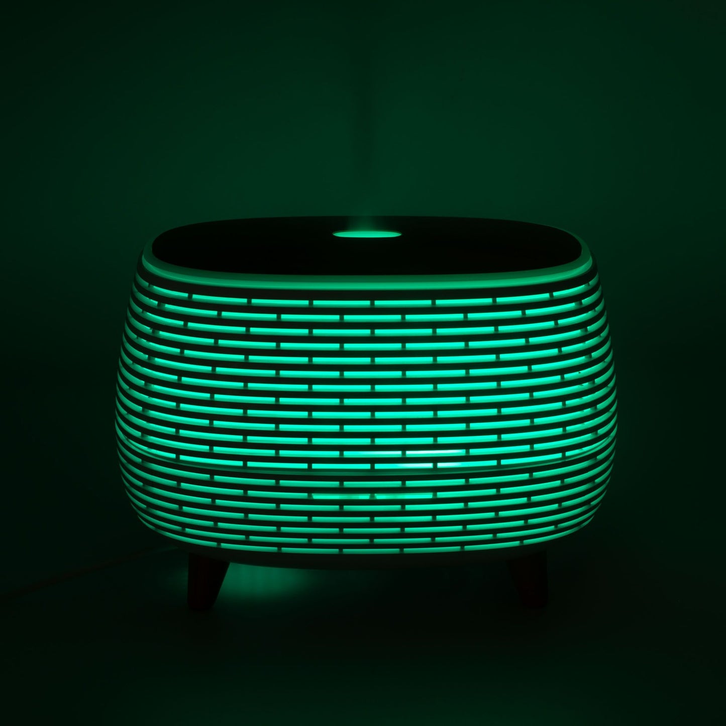 Mesa de luz moderna, verde y negra, de diseño elegante, con luz LED y textura de rejilla.
