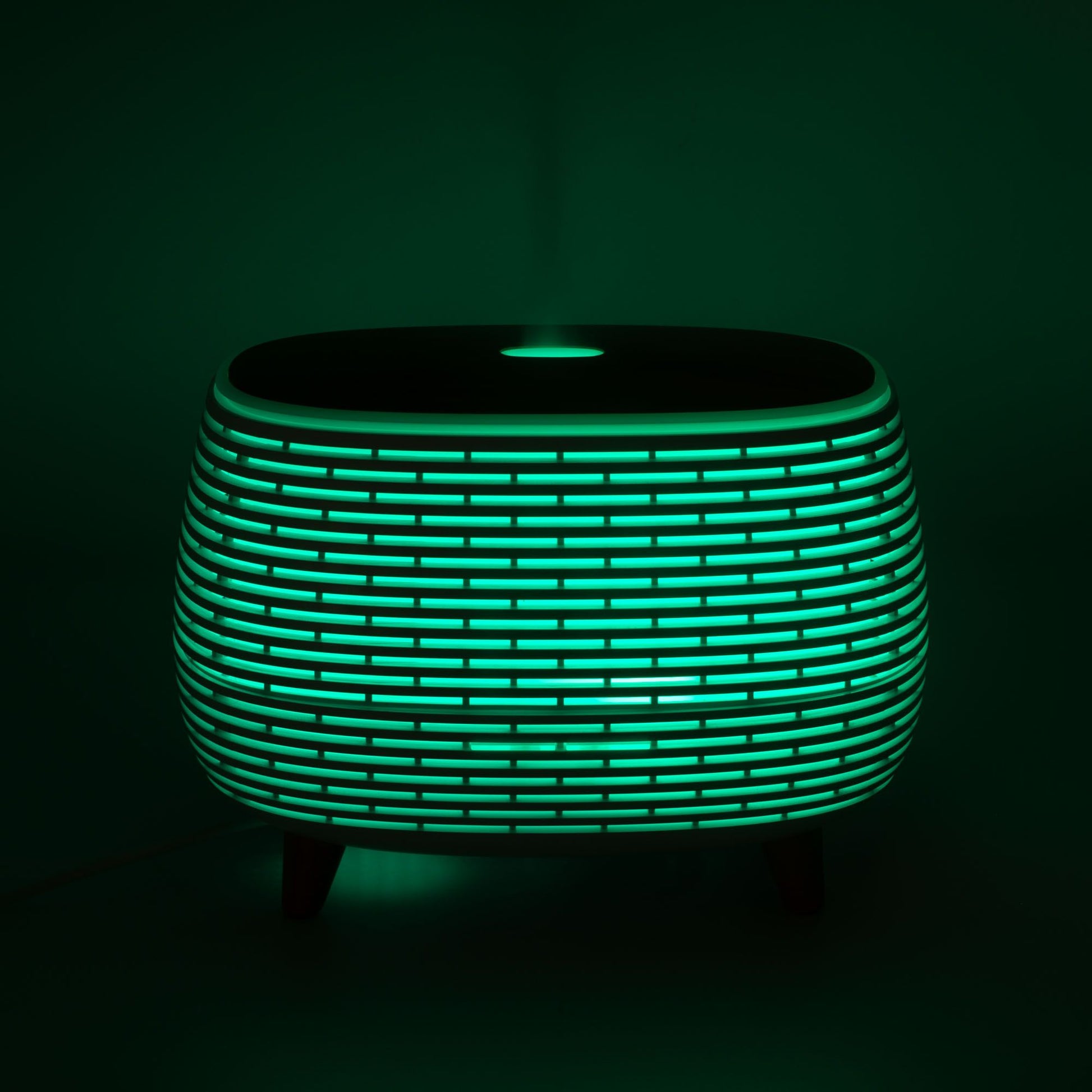 Mesa de luz moderna, verde y negra, de diseño elegante, con luz LED y textura de rejilla.