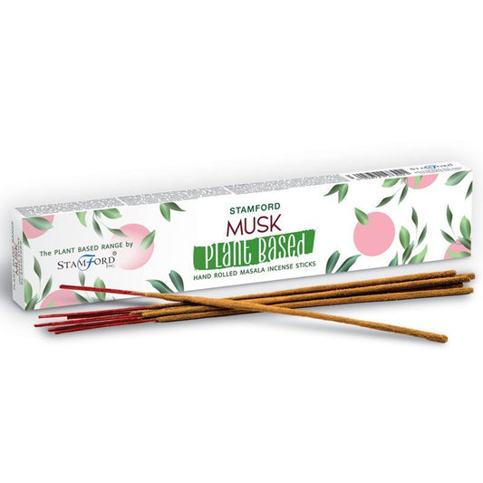 Incienso de almizcle Stamford, palitos marrones de masala, envase blanco con diseño de hojas en colores pastel.
