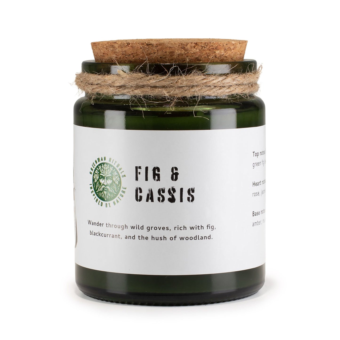 Vela verde en frasco de vidrio con tapa de corcho, aroma a higo y grosella negra. Decoración rústica.