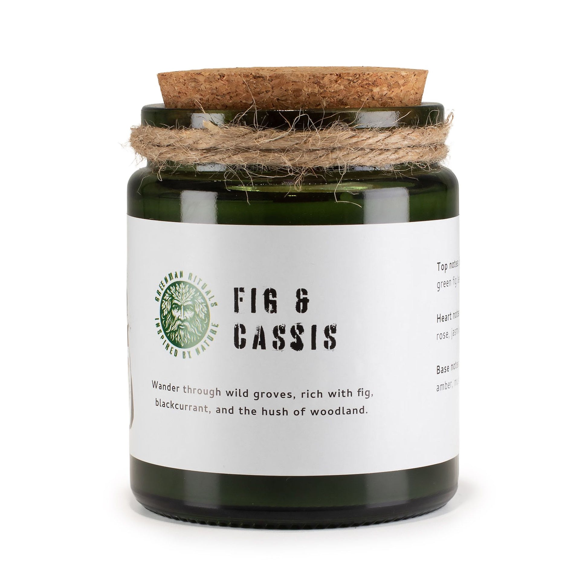 Vela verde en frasco de vidrio con tapa de corcho, aroma a higo y grosella negra. Decoración rústica.