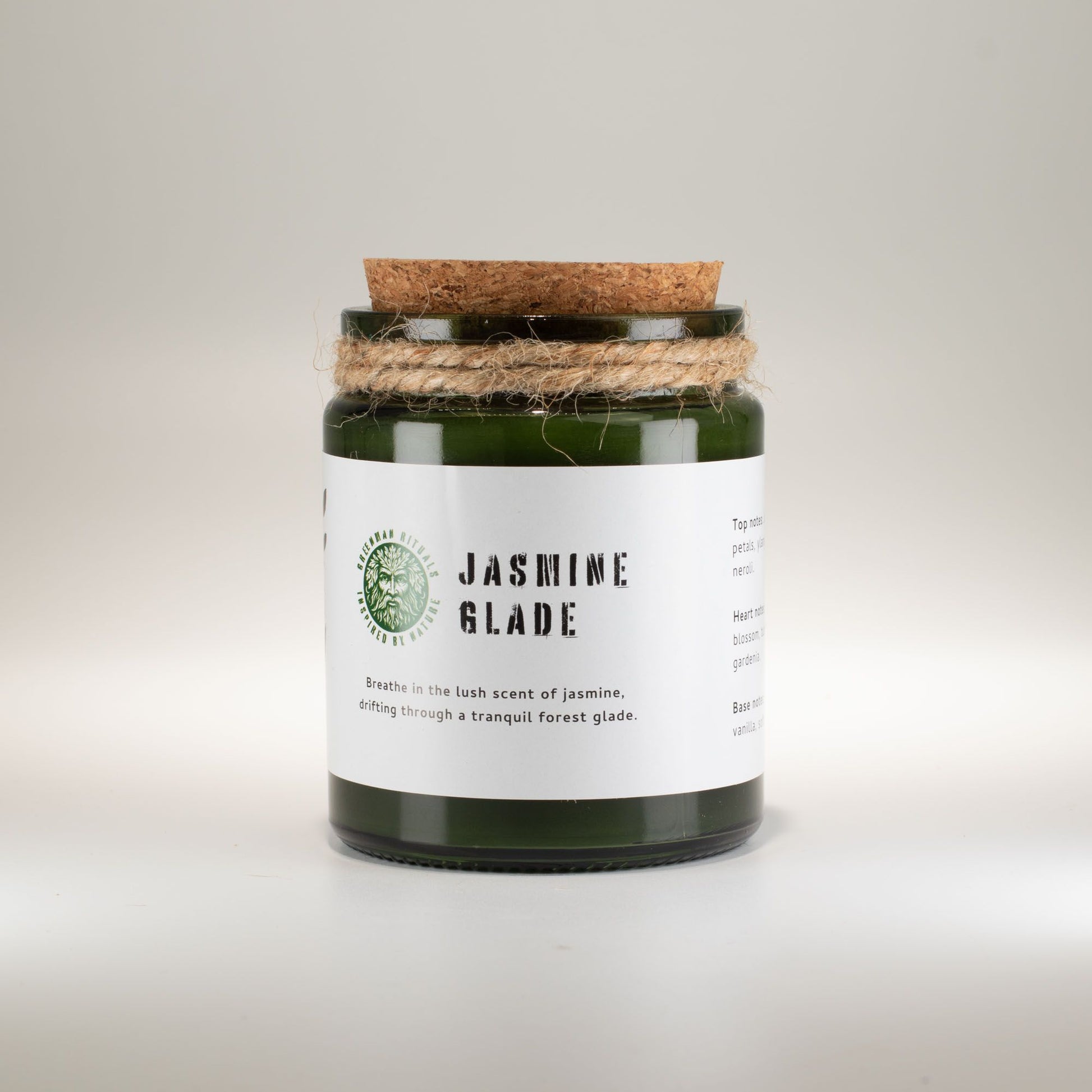 Vela aromática verde con tapa de corcho, fragancia a jazmín, estilo natural y decorativo.