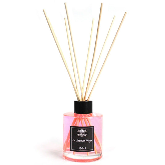 Difusor de aroma de 120 ml en frasco transparente con esencia de jazmín y varitas de bambú. Color rosa vibrante.