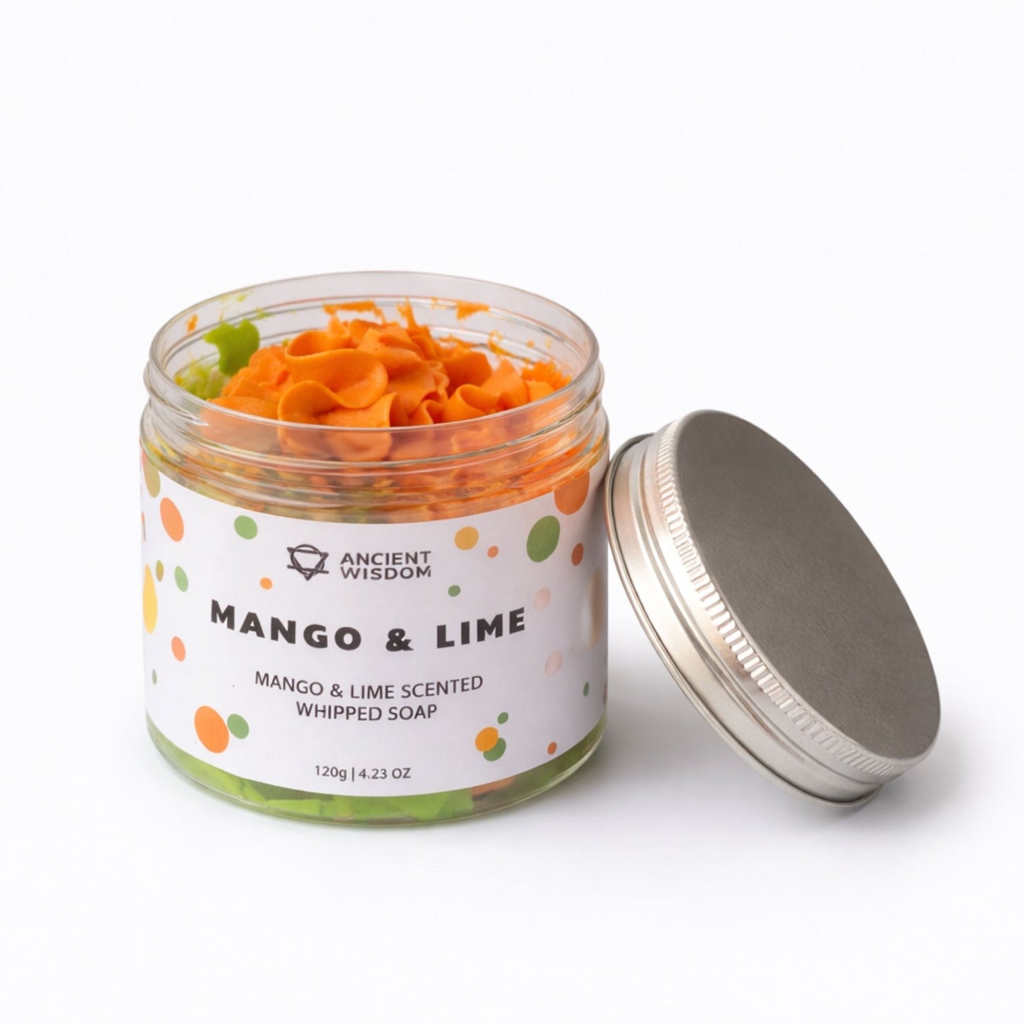 Jabón batido de mango y lima, en frasco transparente con tapa metálica, color naranja y verde. 120g.