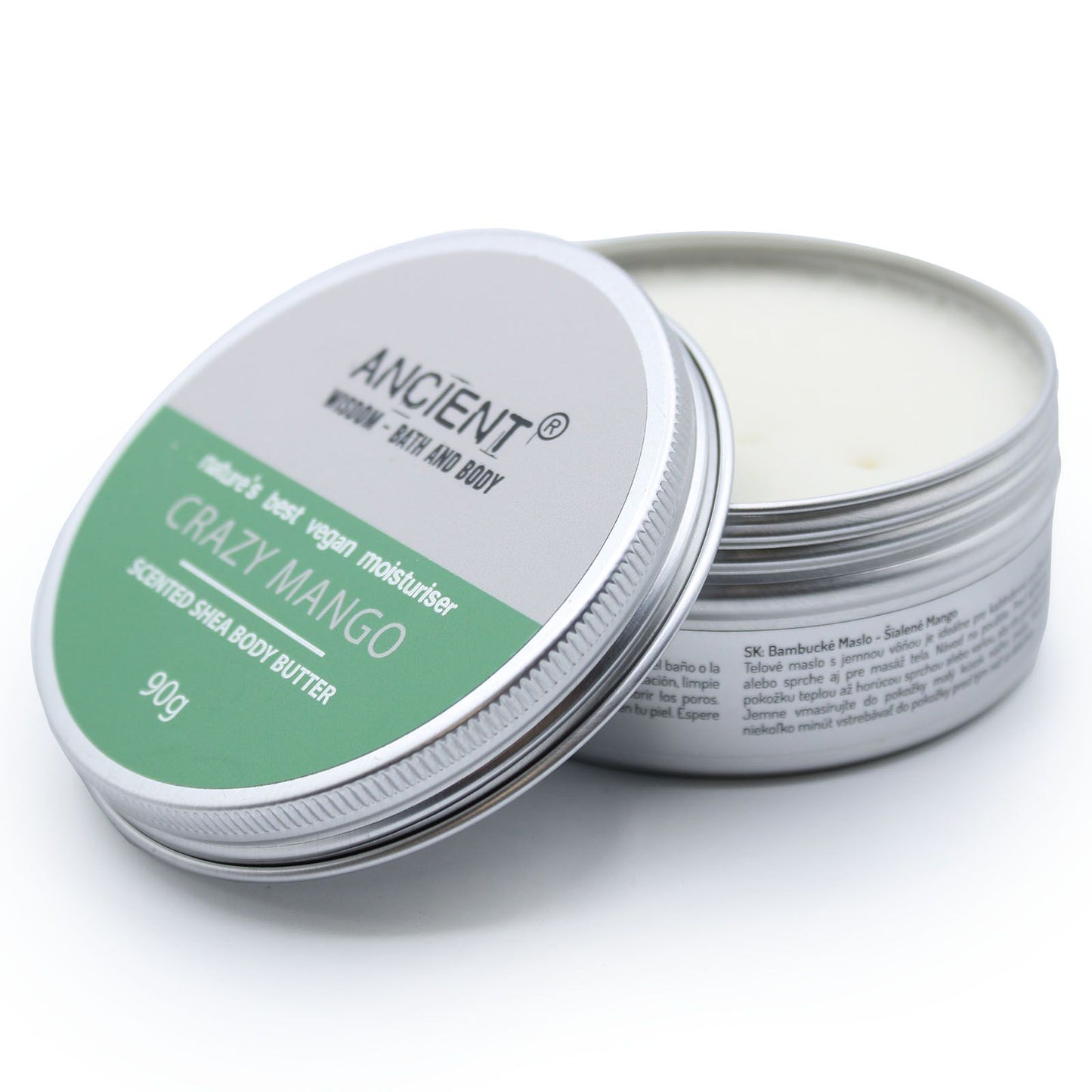 Lata redonda de metal abierta con manteca corporal de karité Ancient Wisdom aroma mango. Etiqueta verde y gris.