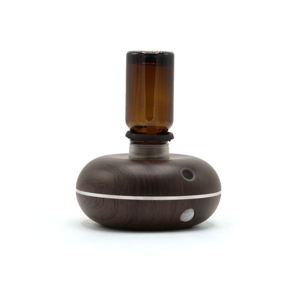Mini difusor de aroma de madera oscura con frasco de vidrio ámbar