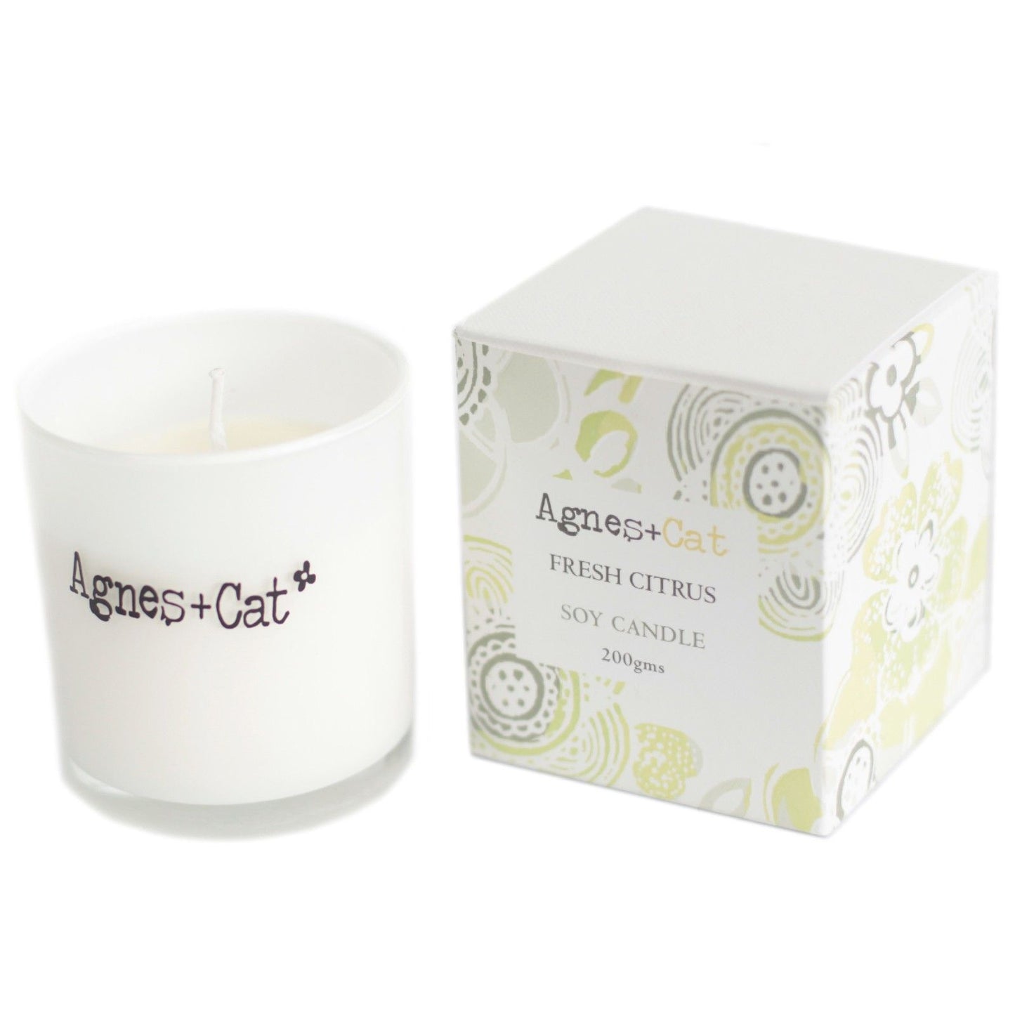 Vela de soja fresca de cítricos, 200 g, en envase blanco con caja decorativa de colores verde y púrpura.