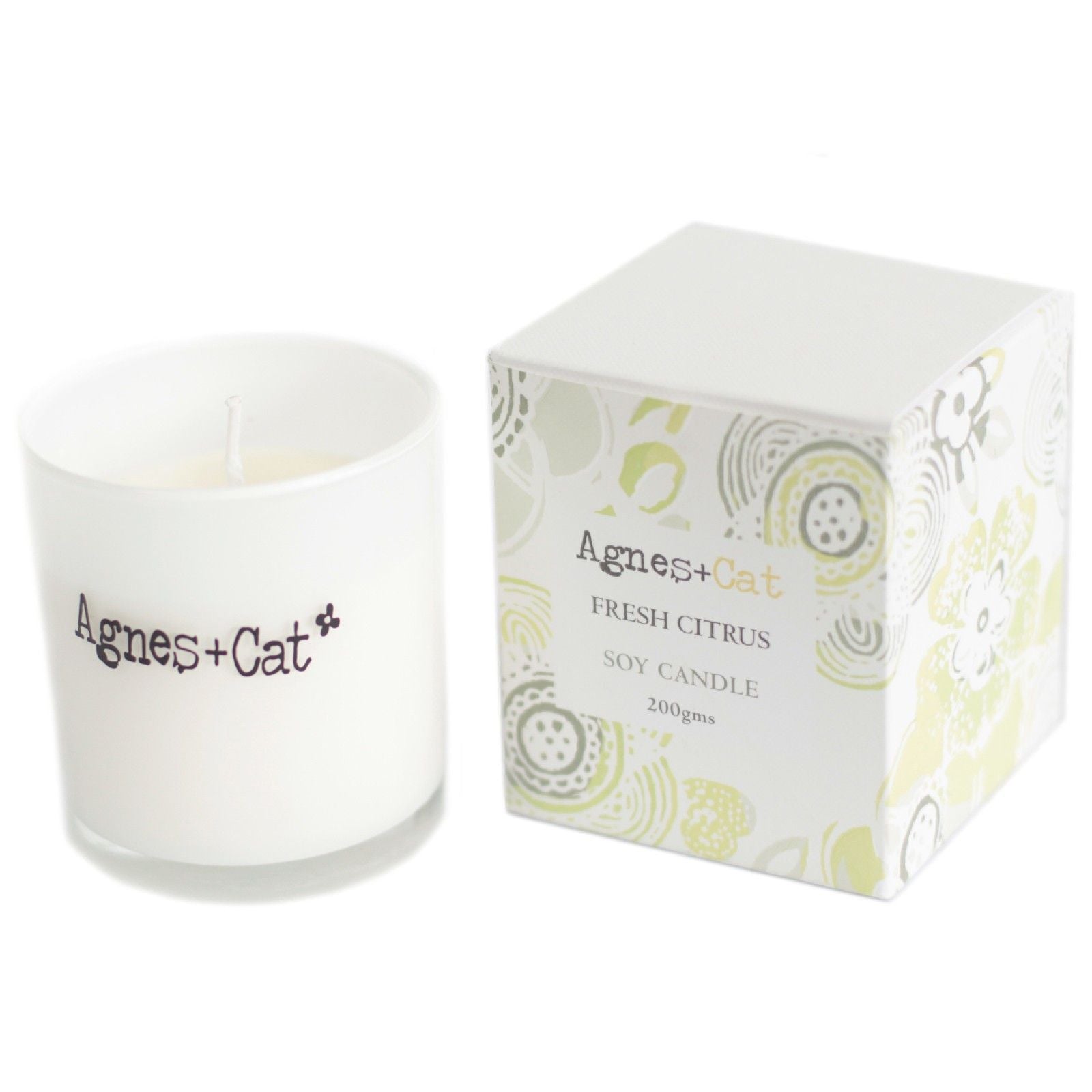 Vela de soja fresca de cítricos, 200 g, en envase blanco con caja decorativa de colores verde y púrpura.