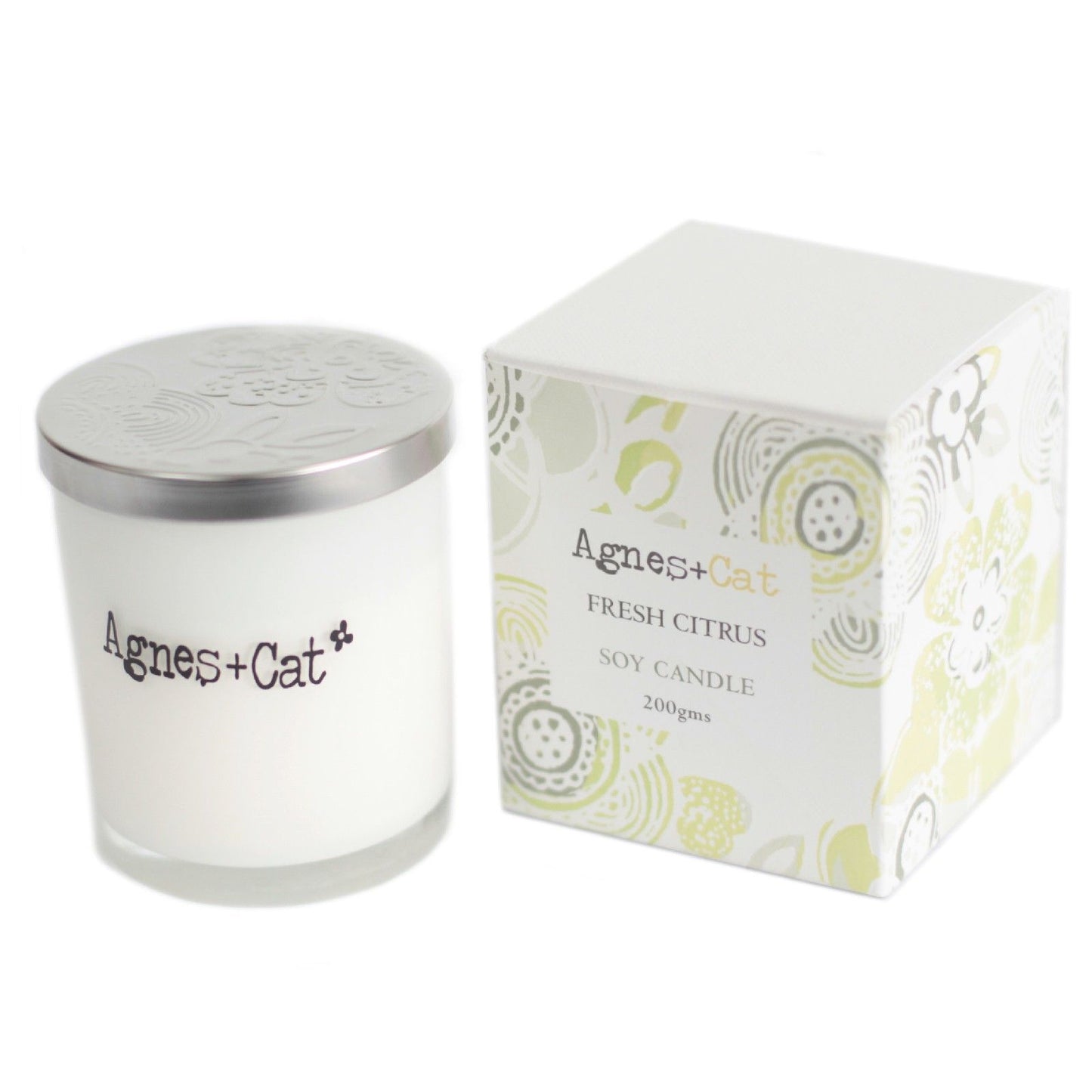 Vela de soja blanca “Fresh Citrus” de 200 g en envase de vidrio con tapa plateada y caja decorativa.