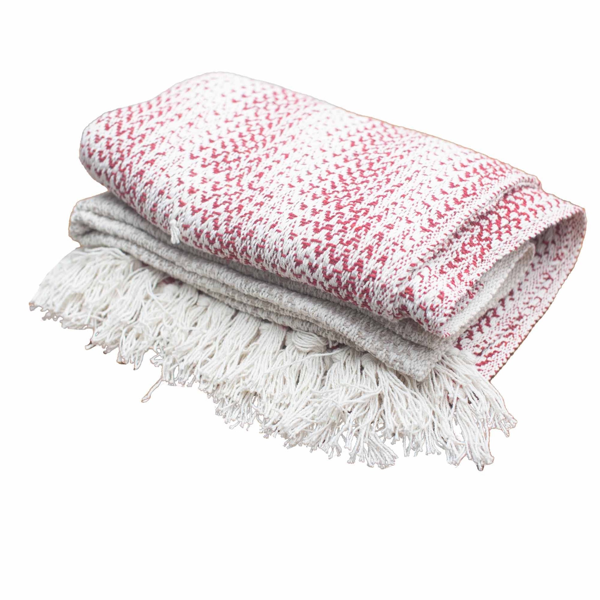 Manta de algodón blanco y rojo con diseño en zigzag y flecos, ideal para decoración y abrigar.