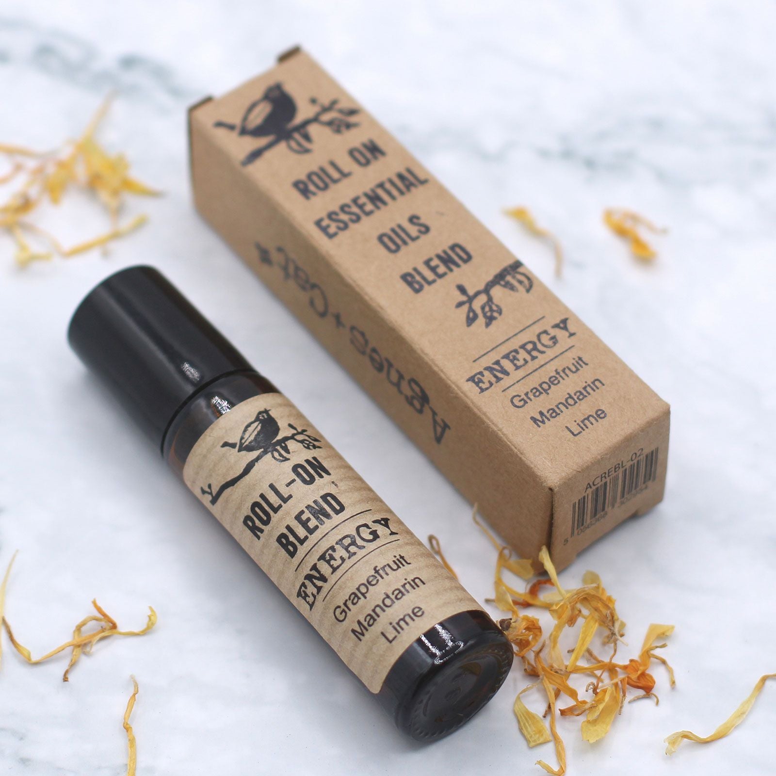 Mezcla de aceites esenciales en roll-on, 10ml, aroma de pomelo, mandarina y lima. Envase de cartón marrón.