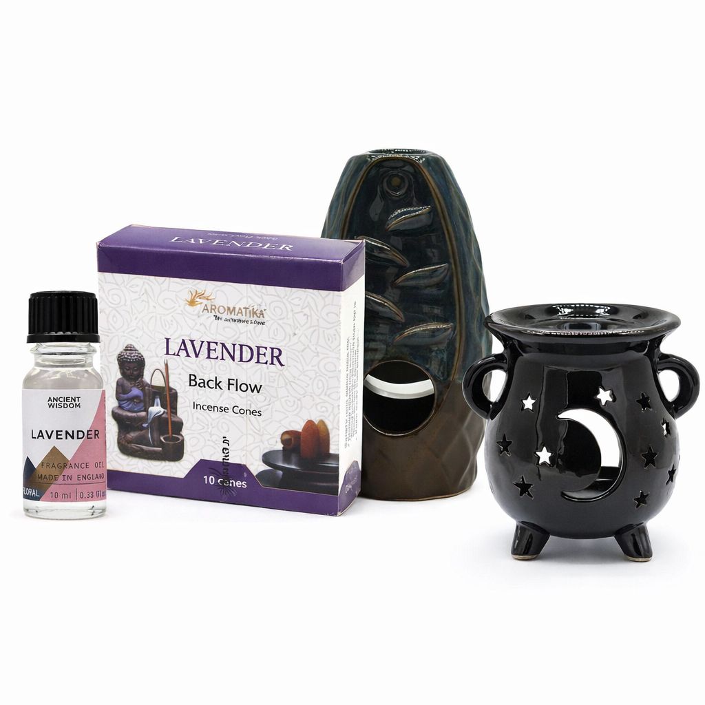 Conjunto de incienso de lavanda, quemador negro con estrellas y luna, y frasco de aceite esencial.