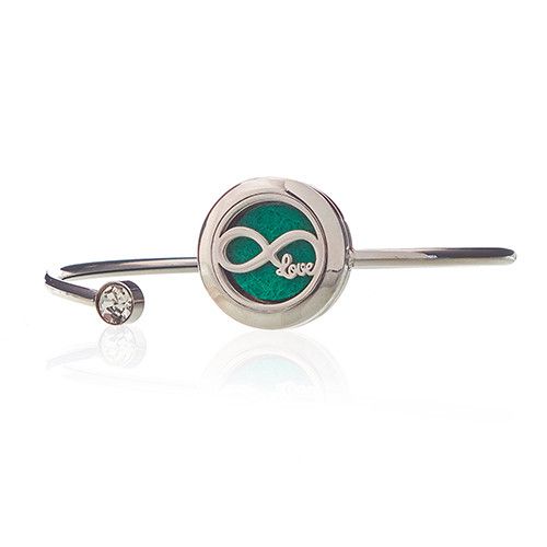 Pulsera de acero inoxidable con charm de infinito en verde y cristal, estilo moderno y elegante.