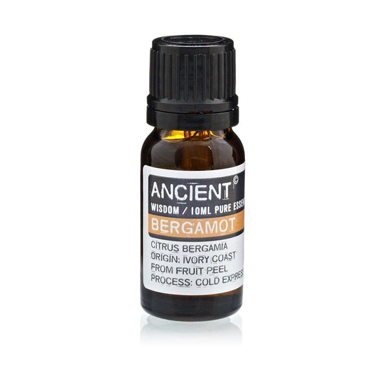 Aceite esencial de bergamota, color ámbar, frasco de vidrio, 10 ml, origen Costa de Marfil, extracción en frío.