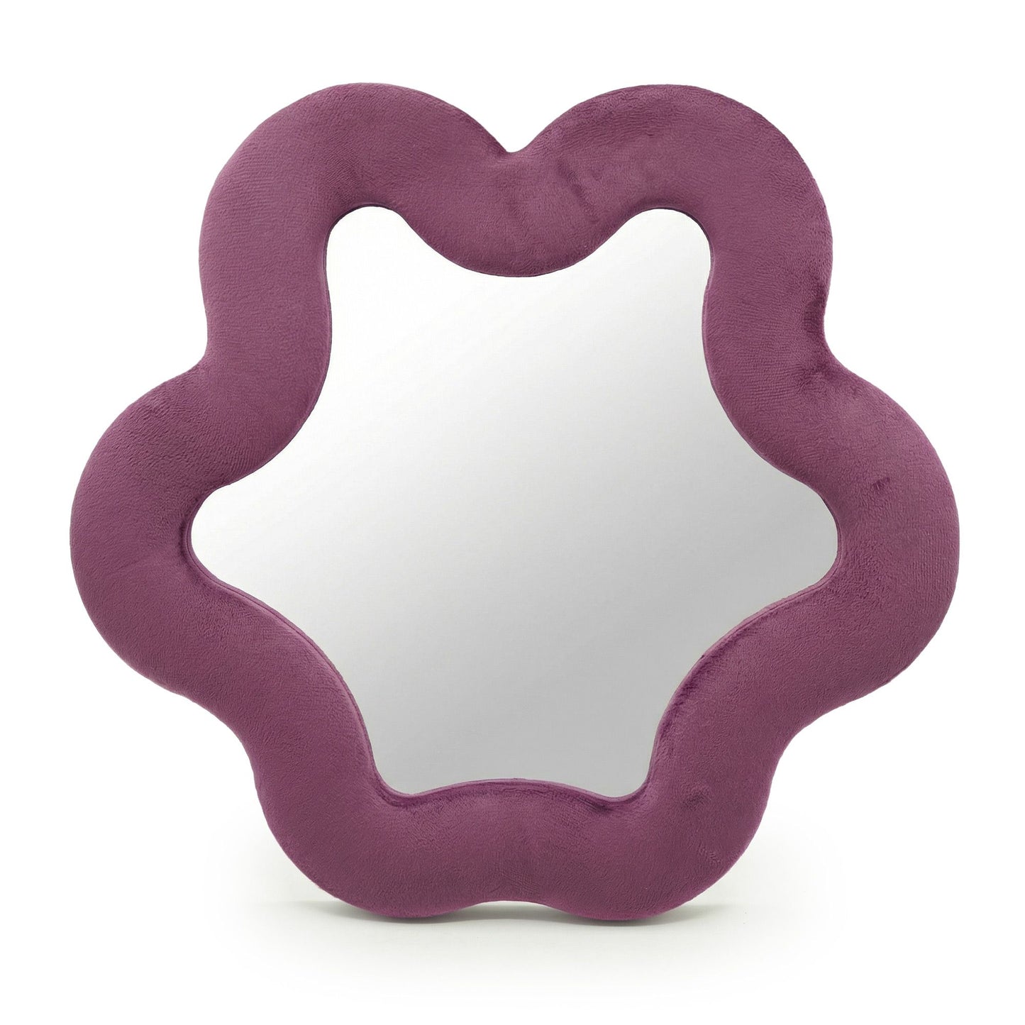 Espejo en forma de estrella con marco de textura suave color malva sobre fondo blanco.