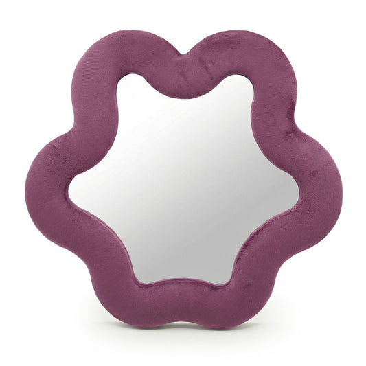 Espejo en forma de estrella con marco de textura suave color malva sobre fondo blanco.