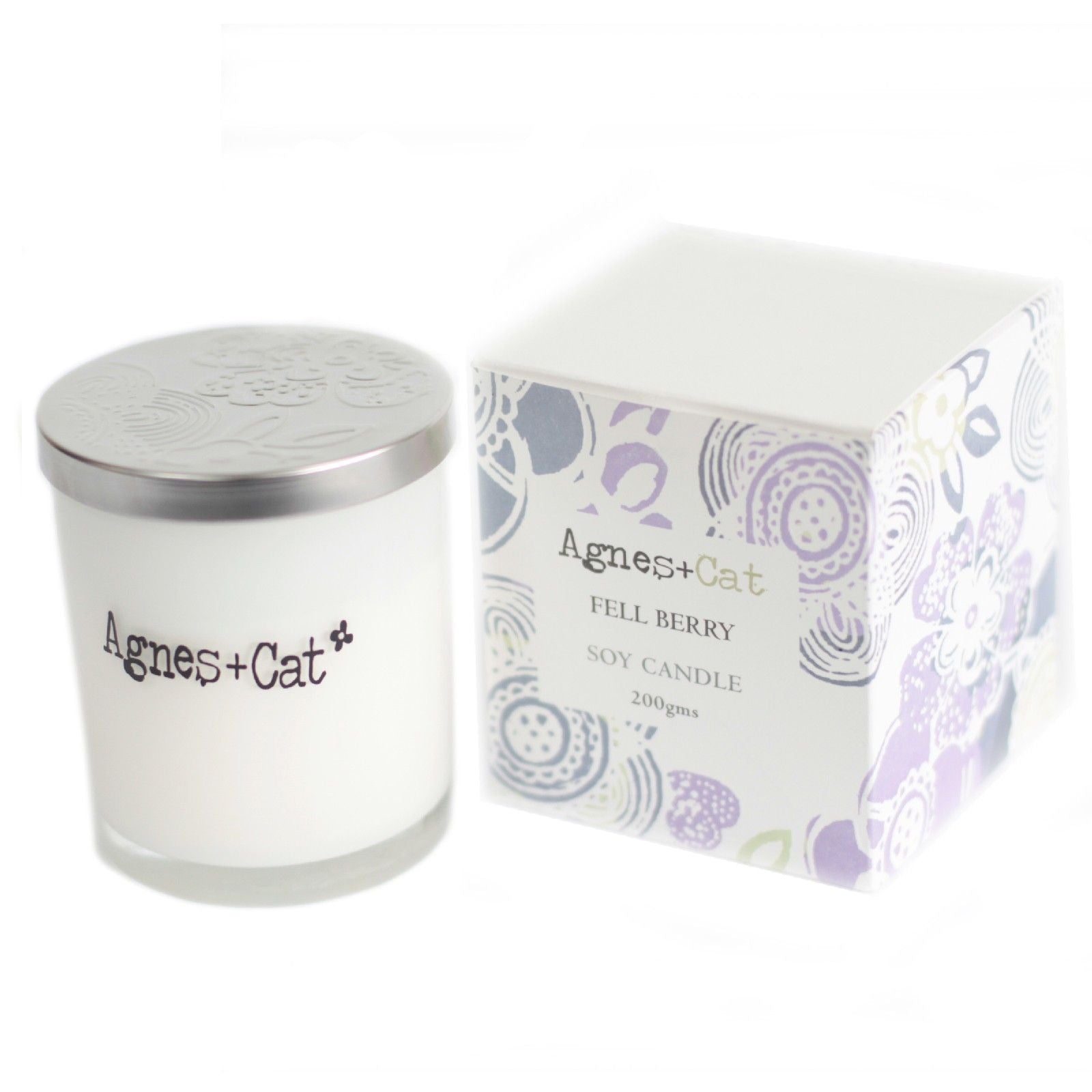 Vela de soja blanca "Fell Berry" de Agnes + Cat, 200g, en envase decorativo con flores.