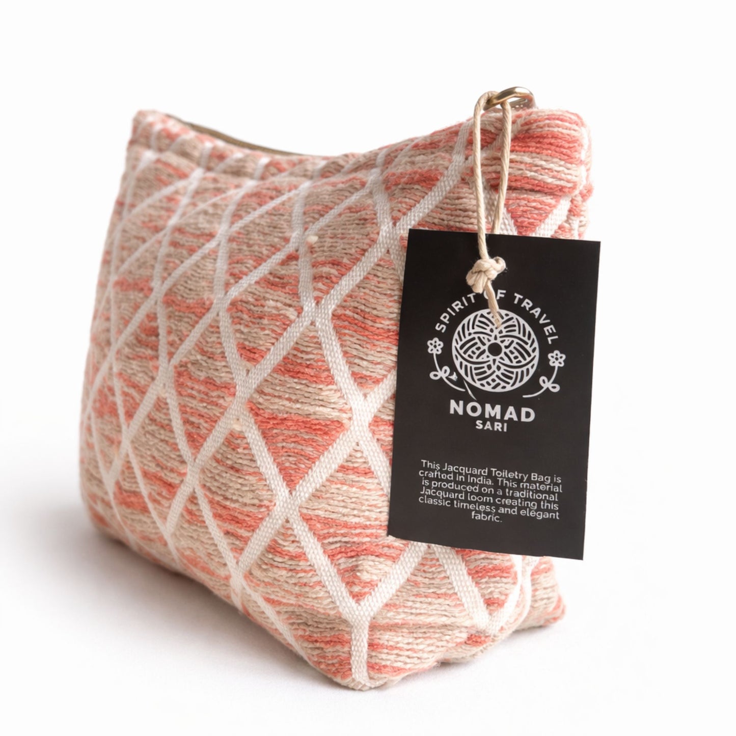 Bolso de baño Jacquard en tonos coral y crema, hecho de sari reciclado, elegante y sostenible.