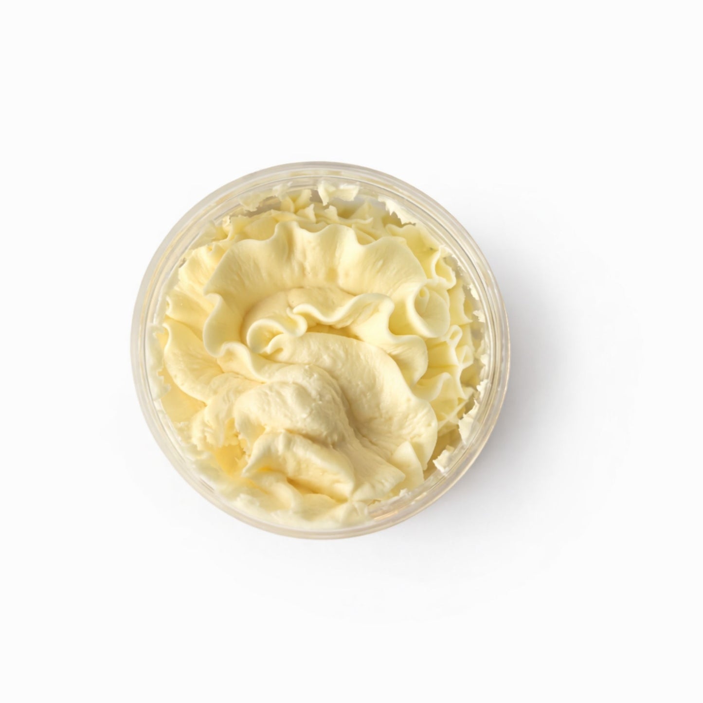 Crema hidratante amarilla en recipiente transparente, con textura suave y sedosa, ideal para todo tipo de piel.