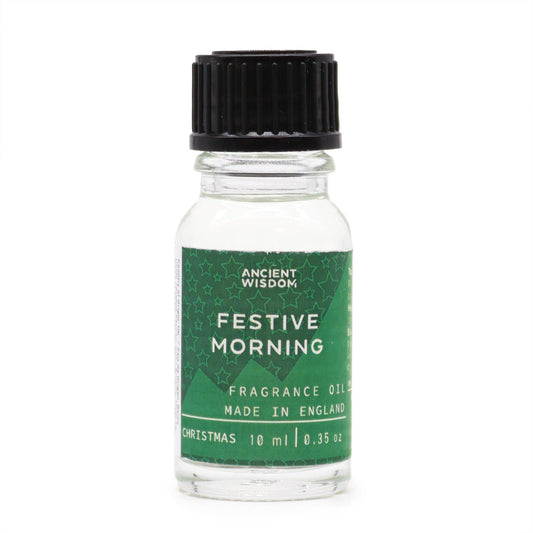 Frasco de vidrio de 10 ml con tapón negro y etiqueta verde con estrellas y texto "Festive Morning". Fondo blanco.