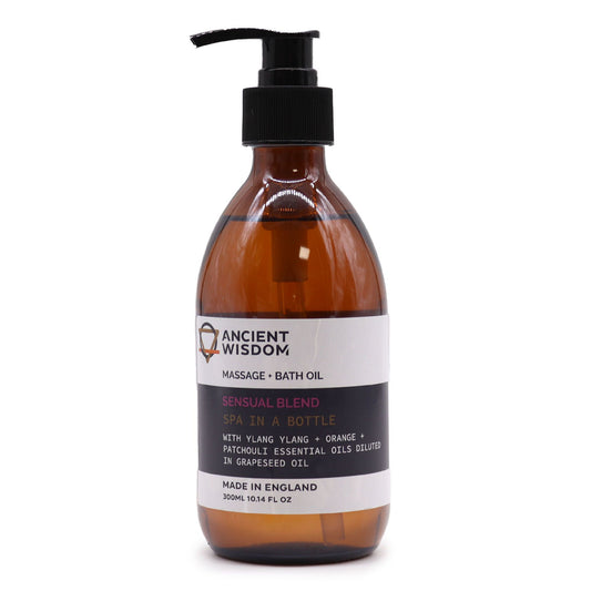 Frasco ámbar de 300 ml con dosificador negro, etiqueta blanca y negra para aceite de masaje y baño. Contenido 300 ml.