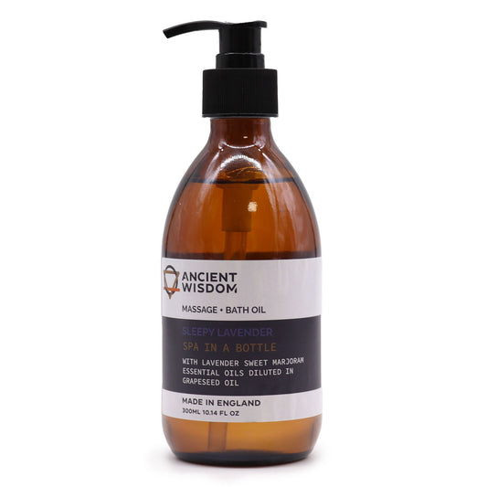 Botella de vidrio ámbar de 300ml con dosificador negro y etiqueta blanca de aceite de masaje y baño de lavanda.