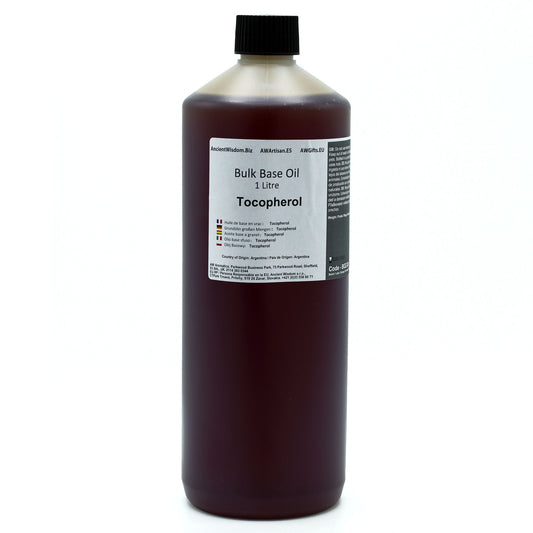 Aceite base en botella de 1 litro, color marrón, con tocoferol, ideal para cosméticos y cuidado personal.