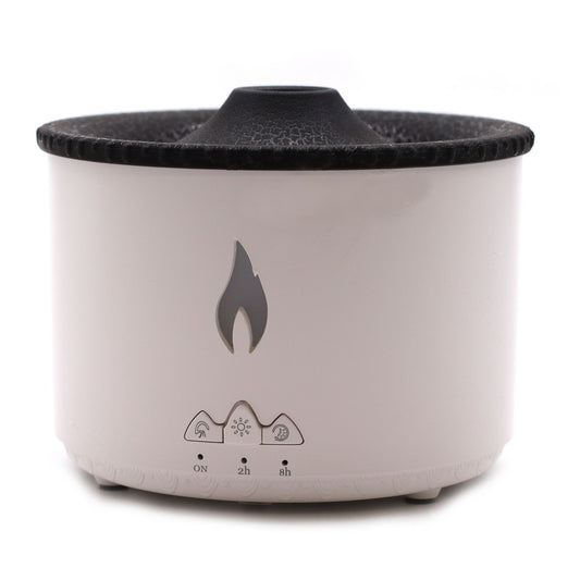 Difusor de aromas volcán blanco y negro, cilíndrico, con botones de control y diseño de llama. Fondo blanco.