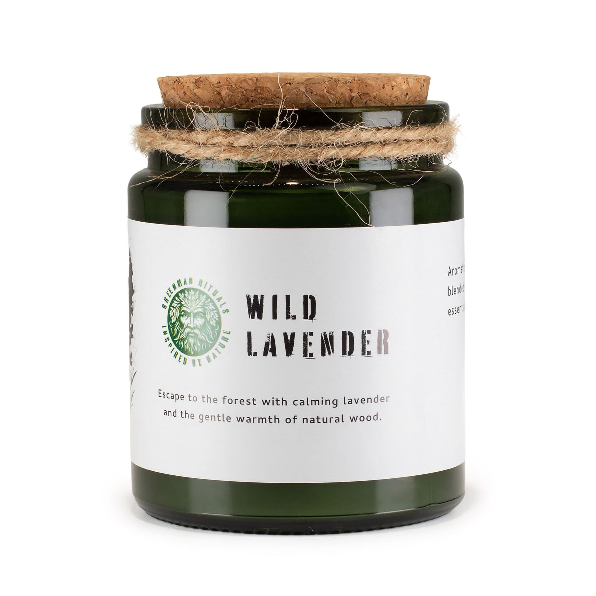Vela aromática verde en frasco de vidrio con tapa de corcho, lavanda silvestre y algodón natural.