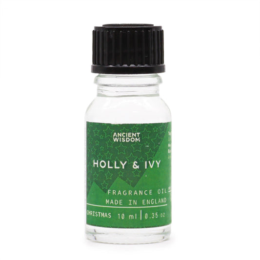 Frasco de vidrio de 10 ml con tapón negro y etiqueta verde decorada con estrellas, aroma de acebo y hiedra.
