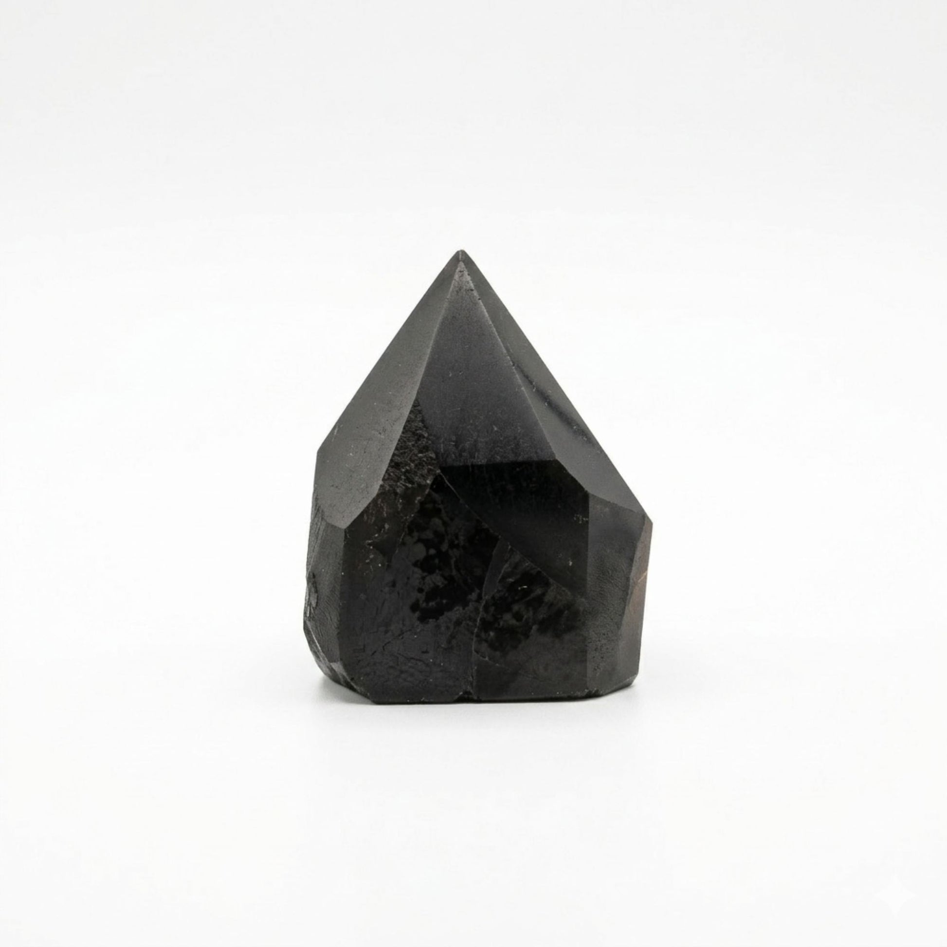 Cristal de obsidiana negra en forma de punta, acabado pulido, ideal para decoración y coleccionismo.