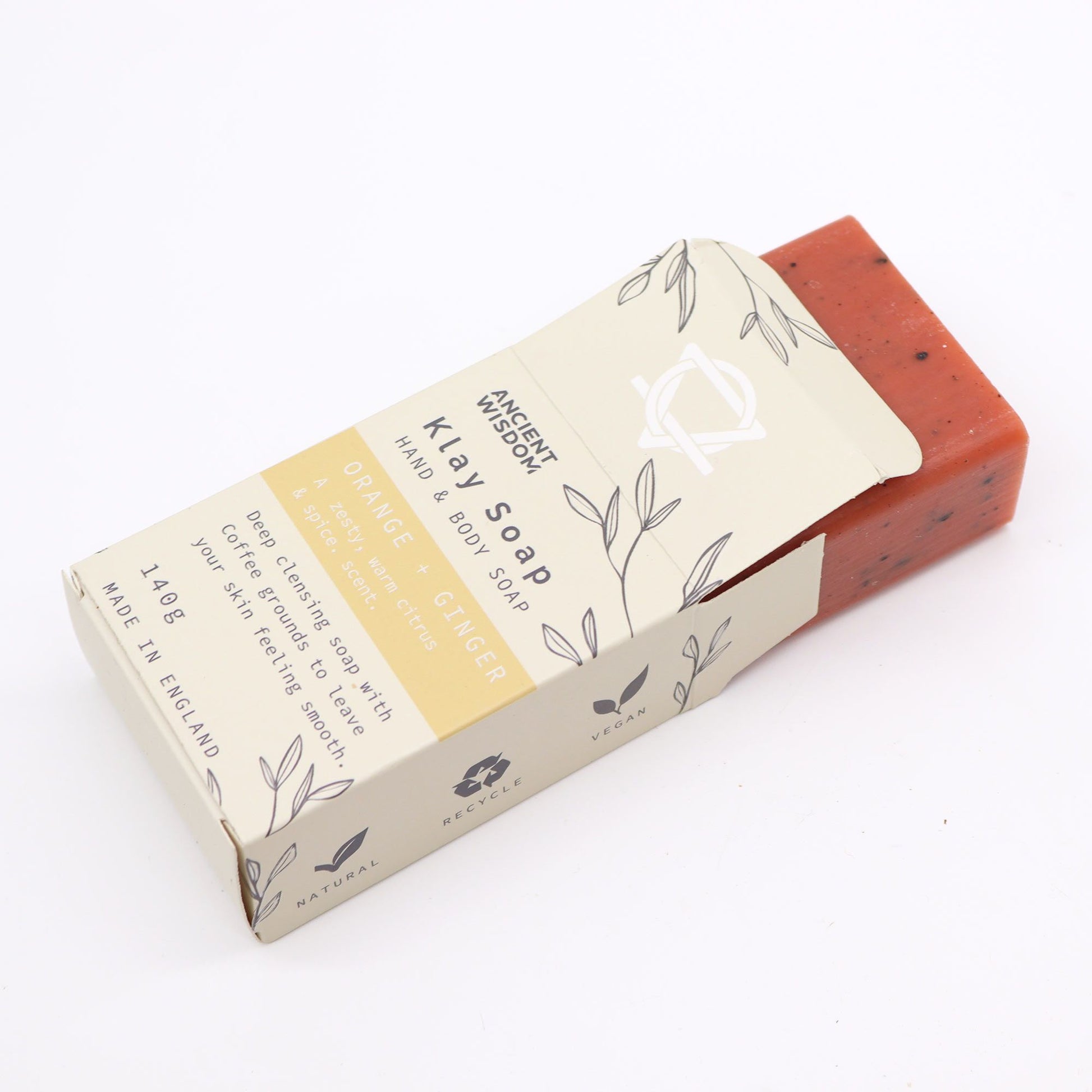 Jabón natural de naranja y jengibre, color naranja, 140 g, envase kraft ecológico, ideal para limpieza corporal.