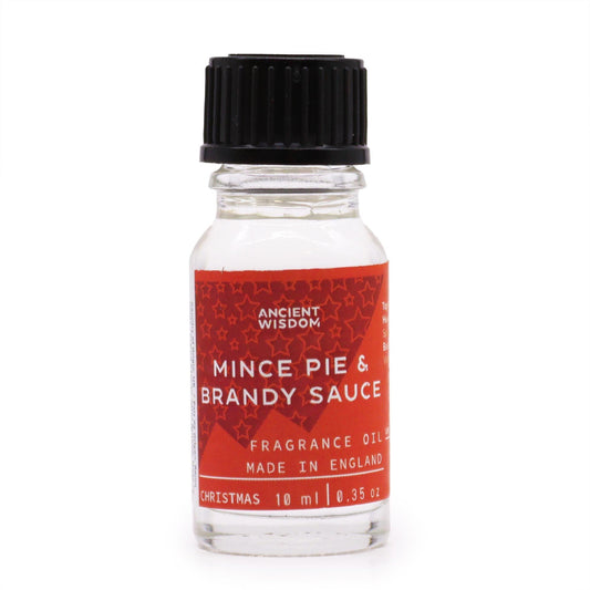 Frasco de cristal transparente de 10 ml con tapón negro y etiqueta roja con estrellas, aroma pastel y brandy.