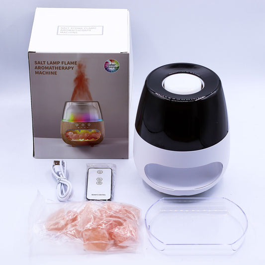 Difusor Ancient Wisdom blanco y negro, con sales, cable USB, control remoto y caja con imagen de efecto llama.