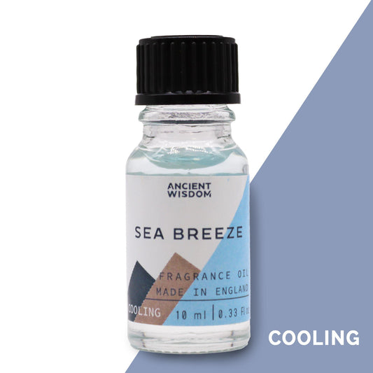 Frasco pequeño de vidrio transparente con aceite de 10ml, tapa negra y etiqueta con tonos azul y marrón tipo brisa marina