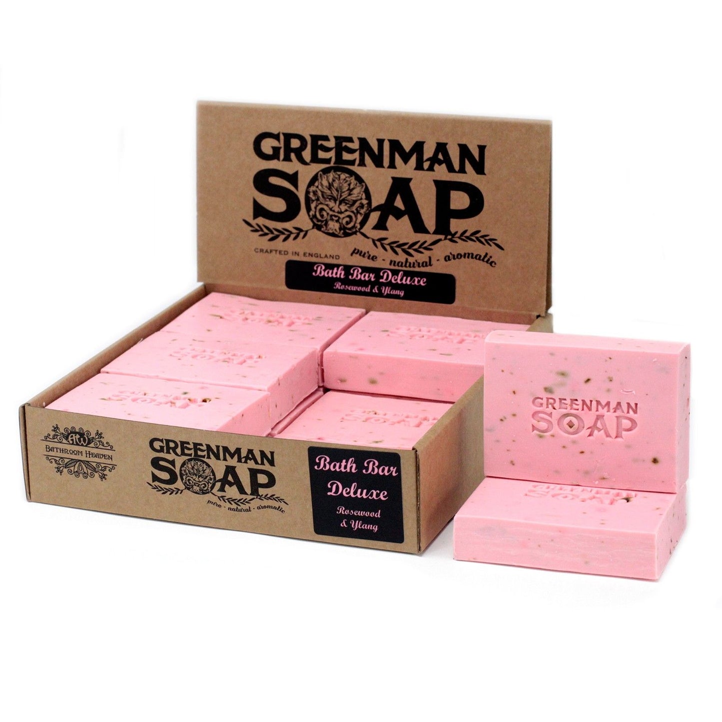 Caja de cartón con jabones rosados Greenman de 100g, con logotipo grabado y partículas orgánicas visibles.