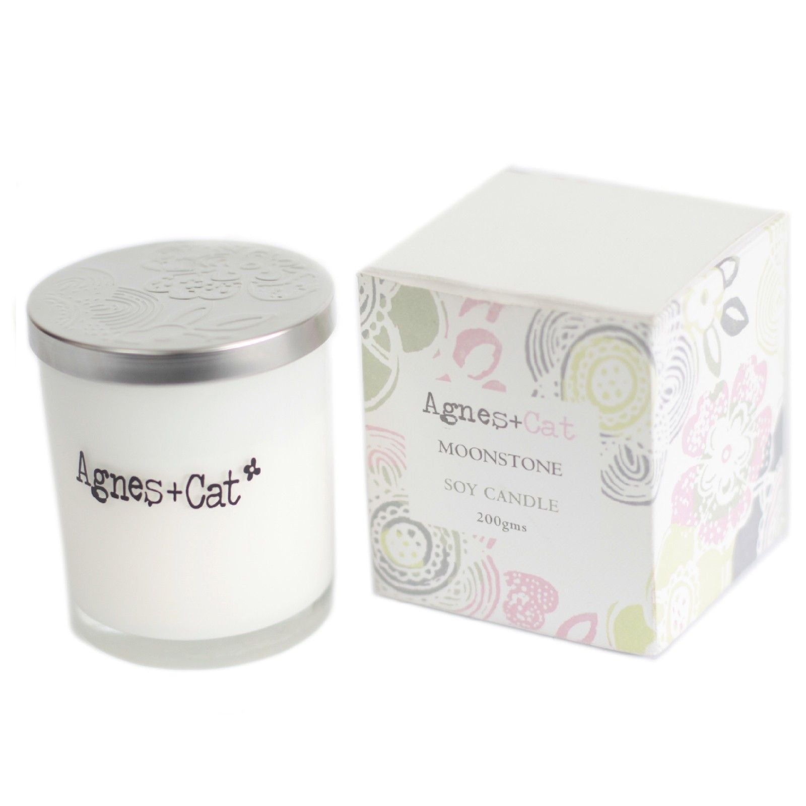 Vela de soja Moonstone de 200g en frasco de vidrio blanco con tapa plateada y caja decorativa de colores suaves.