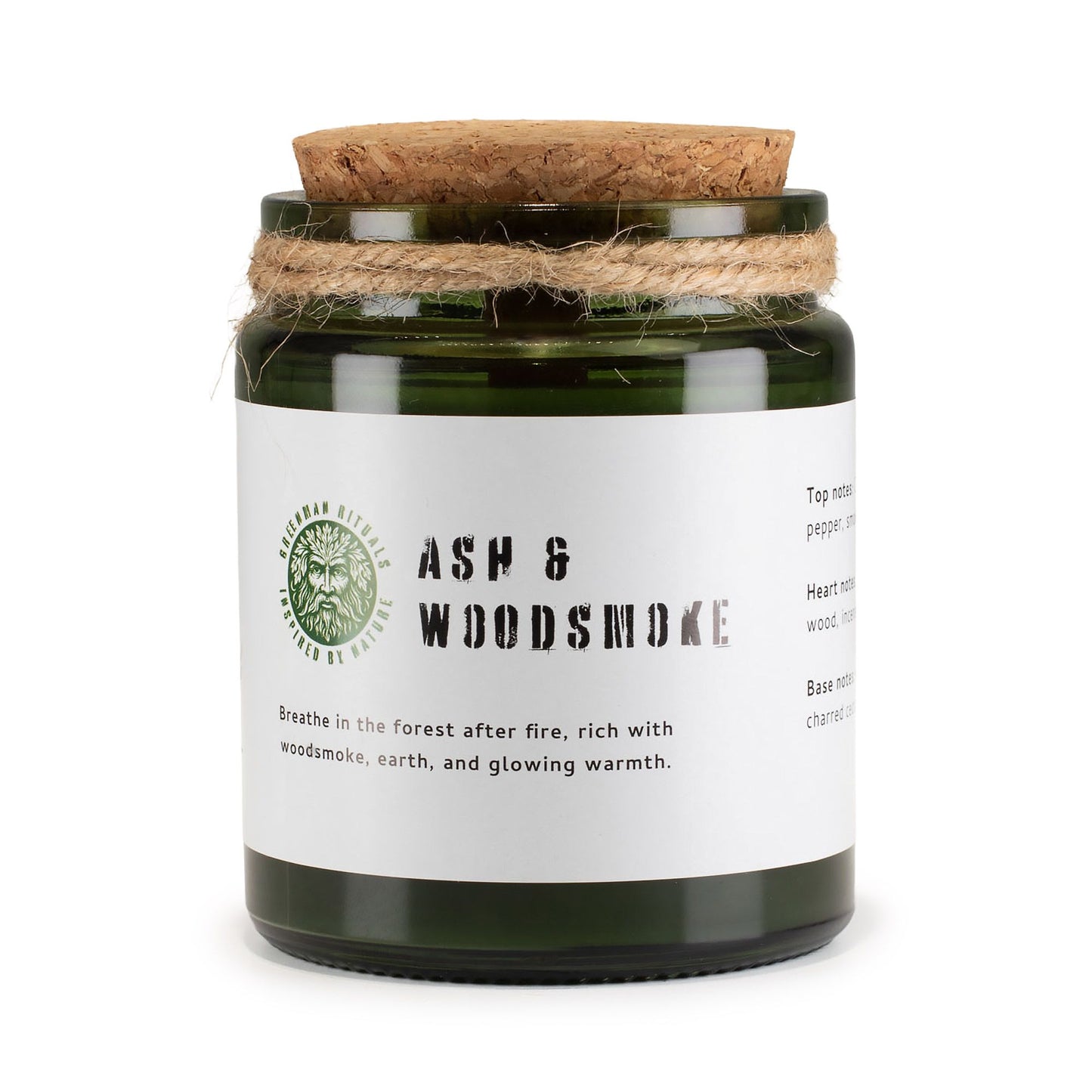 Vela aromática verde en frasco de vidrio con tapa de corcho, aroma a ceniza y humo de madera.
